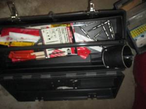 Tool box filled with hand tools and...