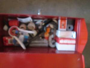Toolbox filled with plumbing suppli...