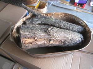 Metal basket full of firewood