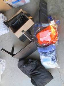 Scarves, snow pants, laptop cooler and chair arms