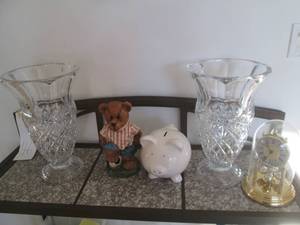 Decor lot featuring a piggy bank, bear figure, clock and vases