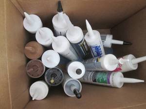 Lot of assorted caulking tubes, most are unopened