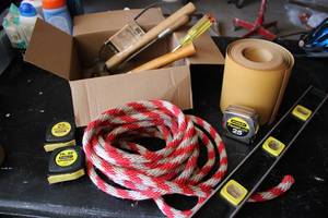 Mixed tools, sandpaper roll, tape m...