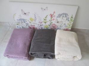 Bath towels and stretched canvas wall art