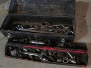 Tool box filled with wrenches and sockets