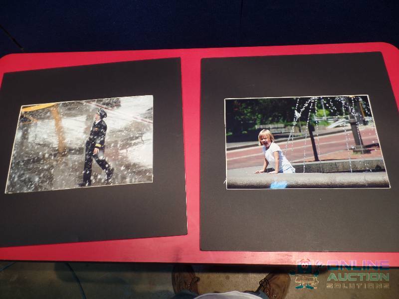 lot 9 image: 2 Foam Board Photography Pieces - Pilot in Snowstorm & Child Laughing in Fountain