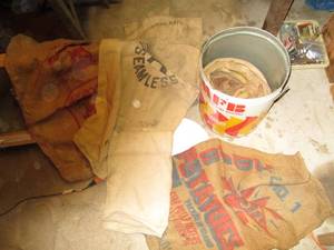 Vintage Tin of gunny sacks and seed...