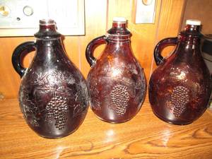 Trio of Amber tone water jugs with ...