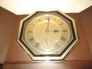 Metal tone Roman numeral wall clock...