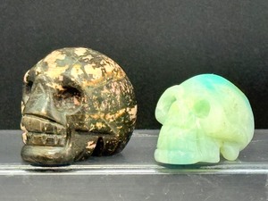 Lot of 2 Hand-Carved Crystal Skulls Rhodonite &amp Caribbean Calcite