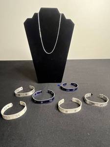 Necklace - Silver Tone Chain with Lot of Cuff Bracelets w Ruler Designs & One w Blue Crystal