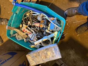 TOTE OF MISC SUPPLY TUBES, DRAINS AND MORE