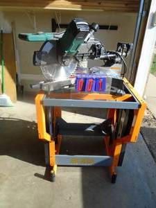 MasterForce 12 miter saw. Looks nearly new. On rolling stand. As shown.