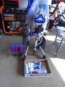 Graco Magnum pro airless sprayer with books & extra tips. Never used. As shown.