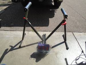 Pair of adjustable roller stands. As shown.