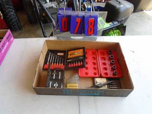 Flat of extractors & drill bits. As shown.