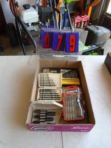 Flat of extractors & drill bits. As shown.