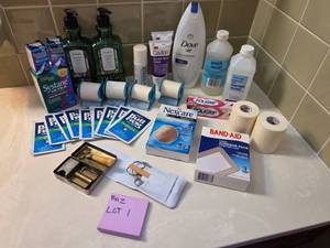 Assortment of bathroom essentials - unopened soap, eye drops, bandages, vintage razor, Witch Hazel, and more