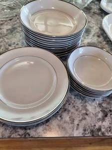 white and silver rimed dishes