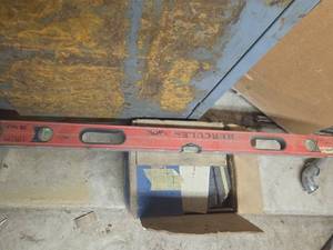 Box of woodworking staples and a Leveler