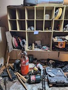Table And Shelf Full Of Hardware And Tools