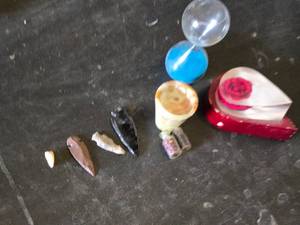 Assorted Collectible Items Including Hourglass, Stone Arrow Points, and Decorative Pieces