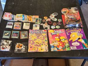 Various Collectibles and Trading Cards including Power Rangers Mystic Cycle Blasters, The Simpsons Comics, and Pok�mon Cards