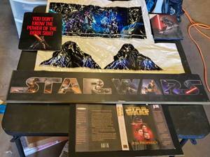 Star Wars Memorabilia Collection including Posters, Plaques, and Book Cover