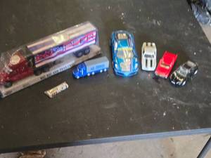 Toy vehicle collection including Big Rig and Trailer, Race Cars, and Mini Tanker Trucks
