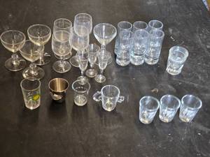 Set of Assorted Glassware Including Shot Glasses, Wine Glasses, and Novelty Glasses
