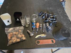 Assorted Bar Accessories including Disaronno Ice Buckets, Shot Glasses, and Wine Stoppers