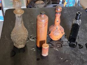 Collection of Vintage Bottles Including Erven Lucas Bols Stoneware, Leather-Wrapped Bottle, and Decorative Glass Decanter