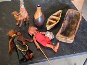 African Cultural Artifacts Collection including Wooden Dolls, Camel Figurine, and Decorative Vessels