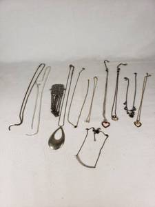 Lot of Necklaces and Pendants Featuring Heart Designs and Various Chains