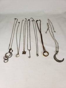 Assorted Necklaces and Pendants Including Moon and Butterfly Designs