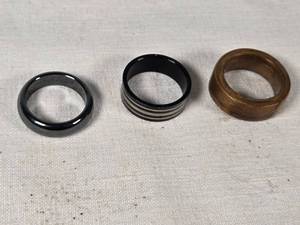 Black Metal and Wood Rings Set including Striped Ring, Plain Black Ring, and Wooden Ring