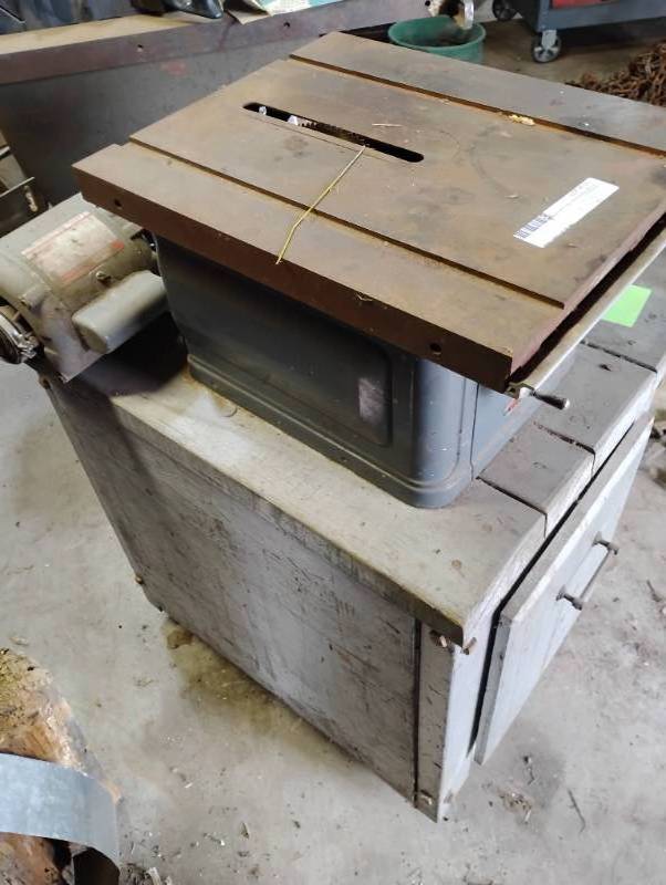 Dunlap table saw on wooden stand