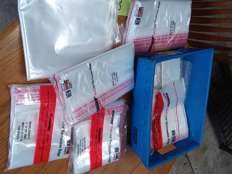 Large lot of redline reclosable bags