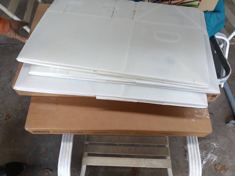 2 boxes of collabsible plastic boxes