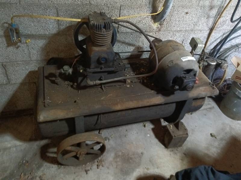 Antique air compressor with hoses