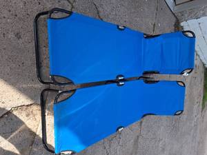 2 blue lounge chairs