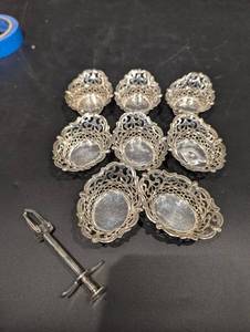 Group of small silver Baskets and olive grabber