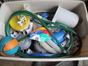 Covered Tote full of pool maintenan...