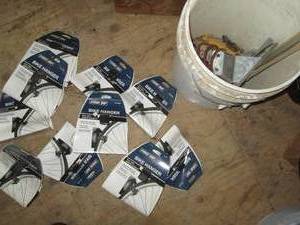 Metal bike hangers and bucket of as...