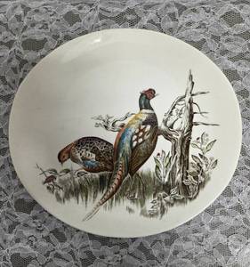 Vintage plate (1953-1976) from the Game Birds series featuring a pheasant design.  Features hand-engraved style illustrations of game birds. Manufactured by the Johnson Brothers, crafted in England.&nbsp&nbsp