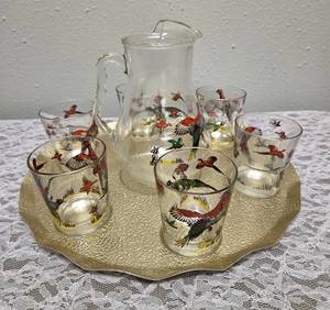 Very Rare and Collectible due to its smaller size. Hazel-Atlas Glass Company Small Pitcher (7" tall) with 6 glasses and tray. These glasses feature the "Pheasants" pattern, produced roughly 1950's.