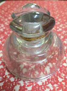 Vintage Clear glass power insulator, commonly called a Ink Well, Frog Eye or Saddle Style and  used on telephone or telegraph poles to hold wires while preventing electricity from grounding.&nbsp&nbsp