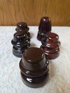 Five Vintage Brown porcelainceramic insulators used for telegraph or telephone lines.&nbsp&nbsp