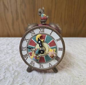 Vintage, hand painted resin musical clock with spinning hands featuring animated twirling mice, often sold as a decorative collectible or music box.&nbsp Check out you-tube video in photos.