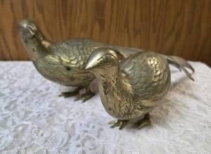 Two vintage brass pheasant figurines. Figurines are solid brass with a polished or natural patina finish and are considered mid-century modern, featuring etched feather detailing.  Approx. 15 long.&nbsp (VERY COLLECTIBLE)